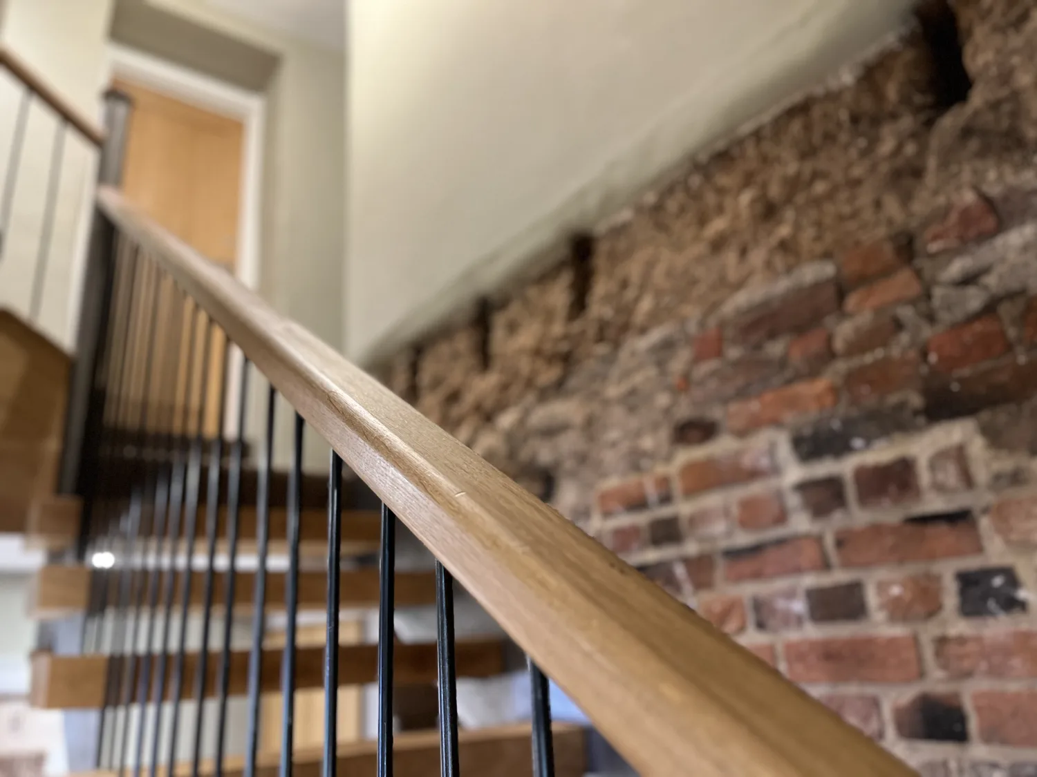 A staircase bannister inside The Roost